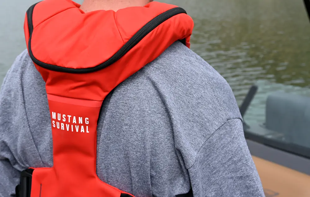 Back of a red Mustang Survival life vest.
