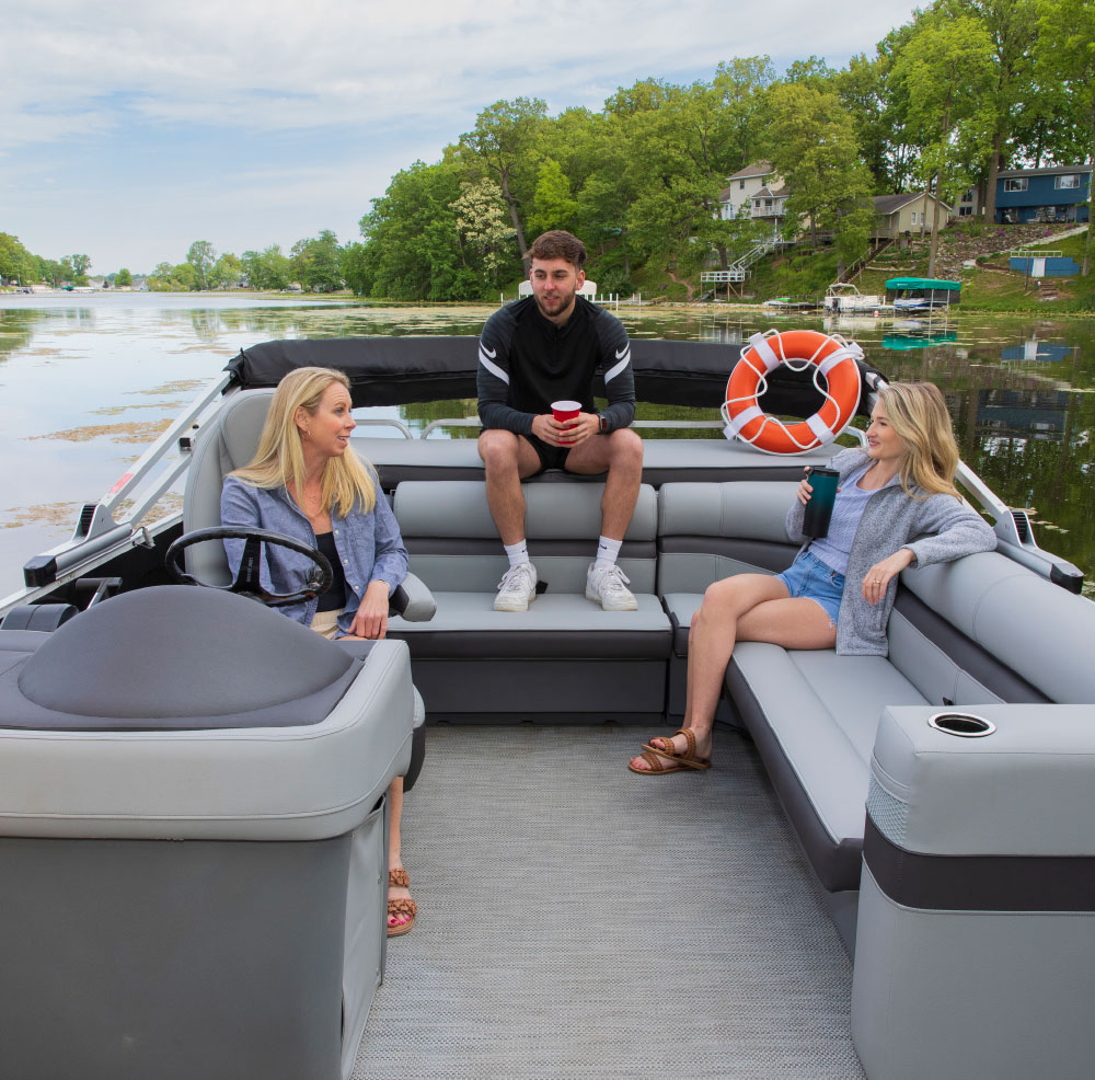 family sitting on Lippert Pontoon Furniture