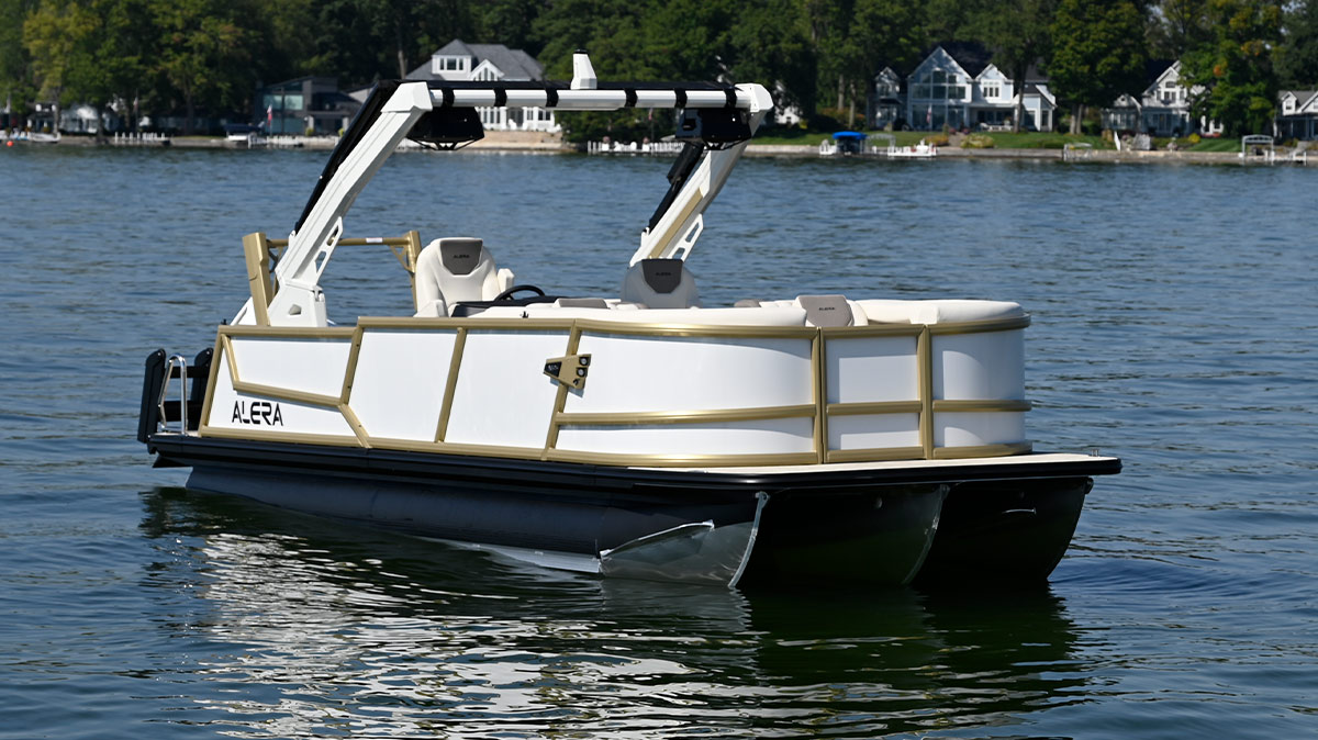 port side, stern view of a white and green-beige trim Alera Marine pontoon