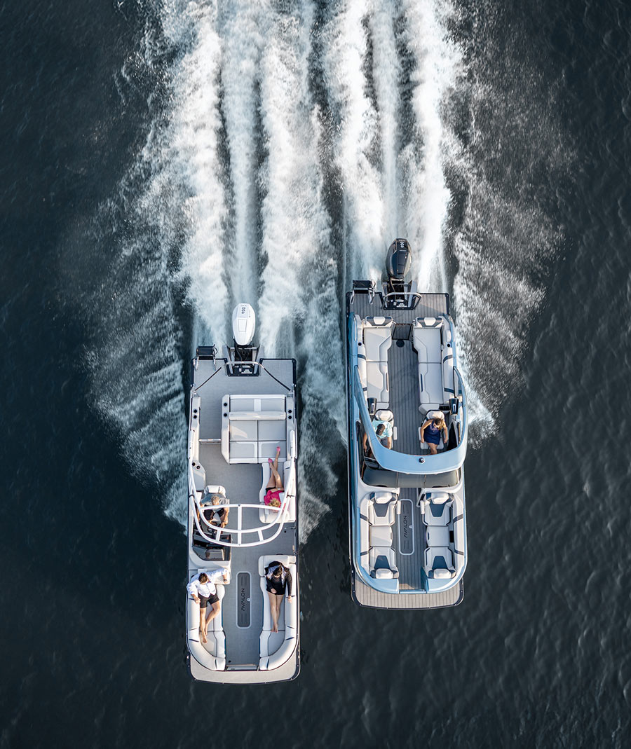 aerial top view of two Avalon pontoons sailing side by side