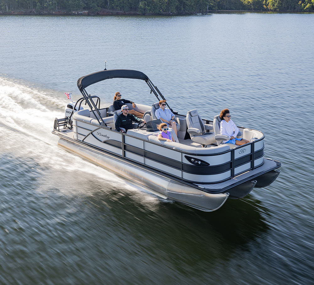 starboard side view of a family enjoying a ride on a Bentley pontoon