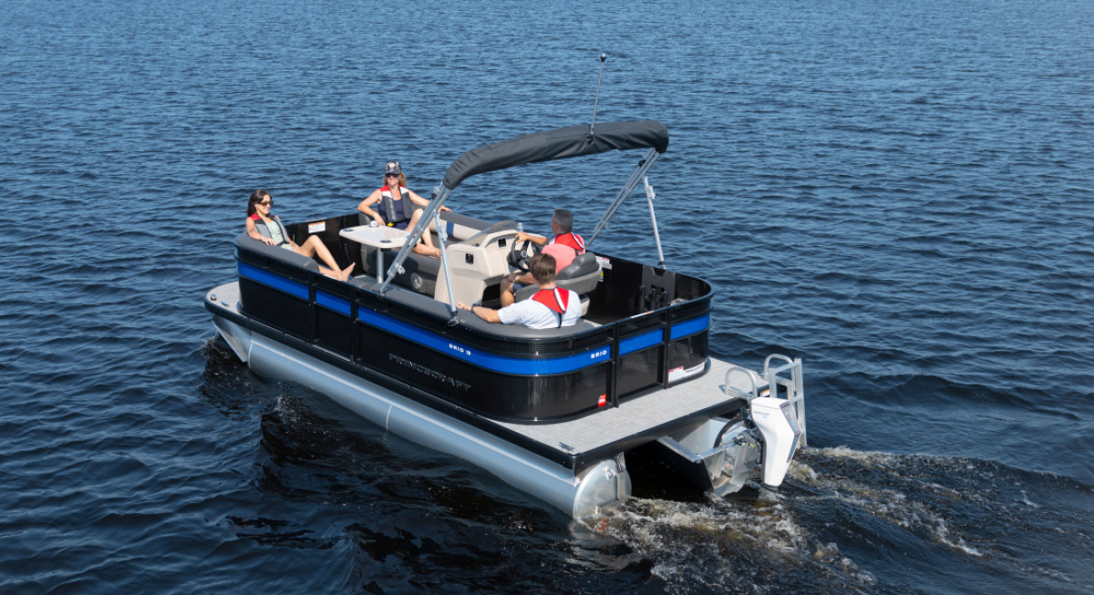 A group of four people inside a Princecraft Brio e 19 pontoon motorboat vehicle as it is stationary out on the water