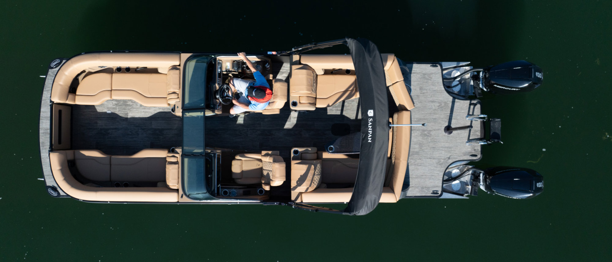 top view of Godfrey Sanpan 2700 ULW Twin with man in driver's seat