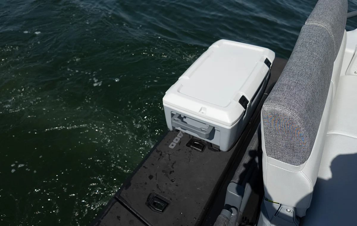 Close-up of a LinQ thermal cooler mounted on the swim platform of a modern boat, showcasing easy-access storage for marine recreation.