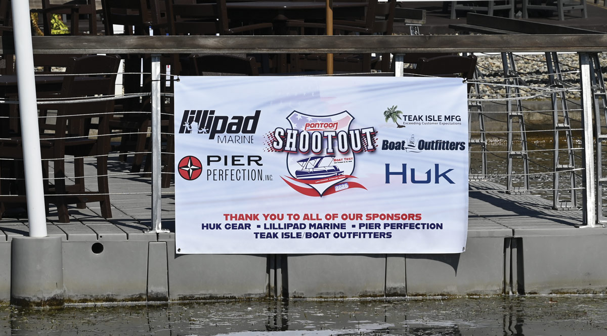 A large event banner on a dock lists sponsors including Huk Gear, Lillipad Marine, Pier Perfection, and Teak Isle/Boat Outfitters for the 2026 Shootout.