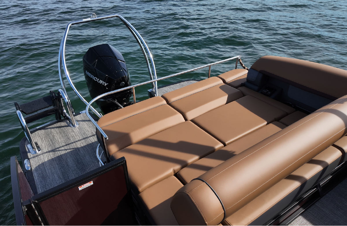 Alternative view of the rear deck showing the lounge seat folded down into a large flat sunpad next to the engine.