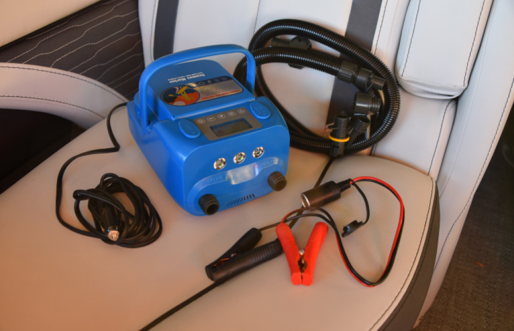 A blue Seamax Marine electric air pump for inflatables, shown with various nozzle attachments and power cables.