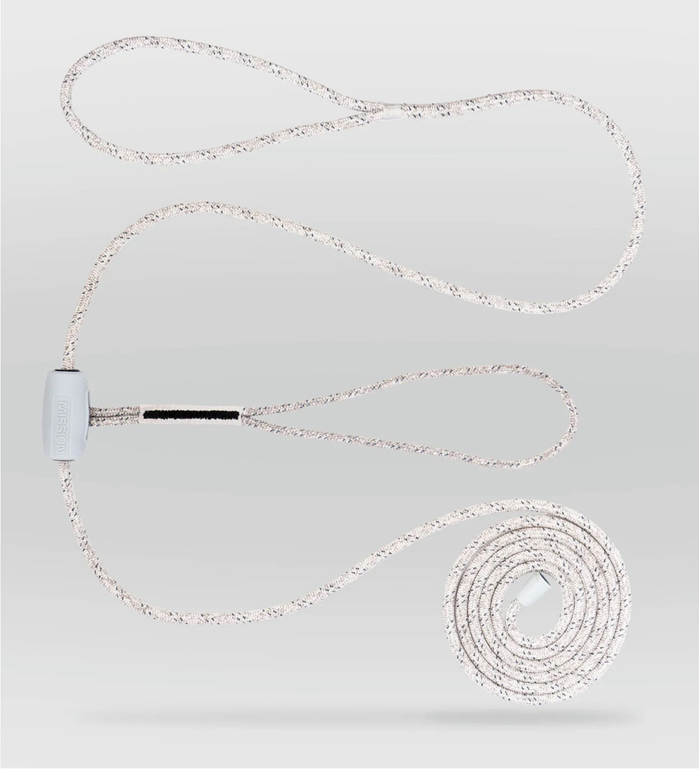 A speckled Mission DREADKNOT dock line with two looped ends and a white Slide-Lock adjustment piece. The rope is laid out against a light gray background with one end neatly coiled.