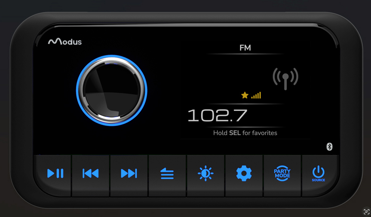 A close-up of a Garmin marine radio integrated into a boat's dark grey dashboard. The digital display shows channel 16 for distress and safety, along with GPS coordinates. A physical dial knob sits adjacent to the screen.