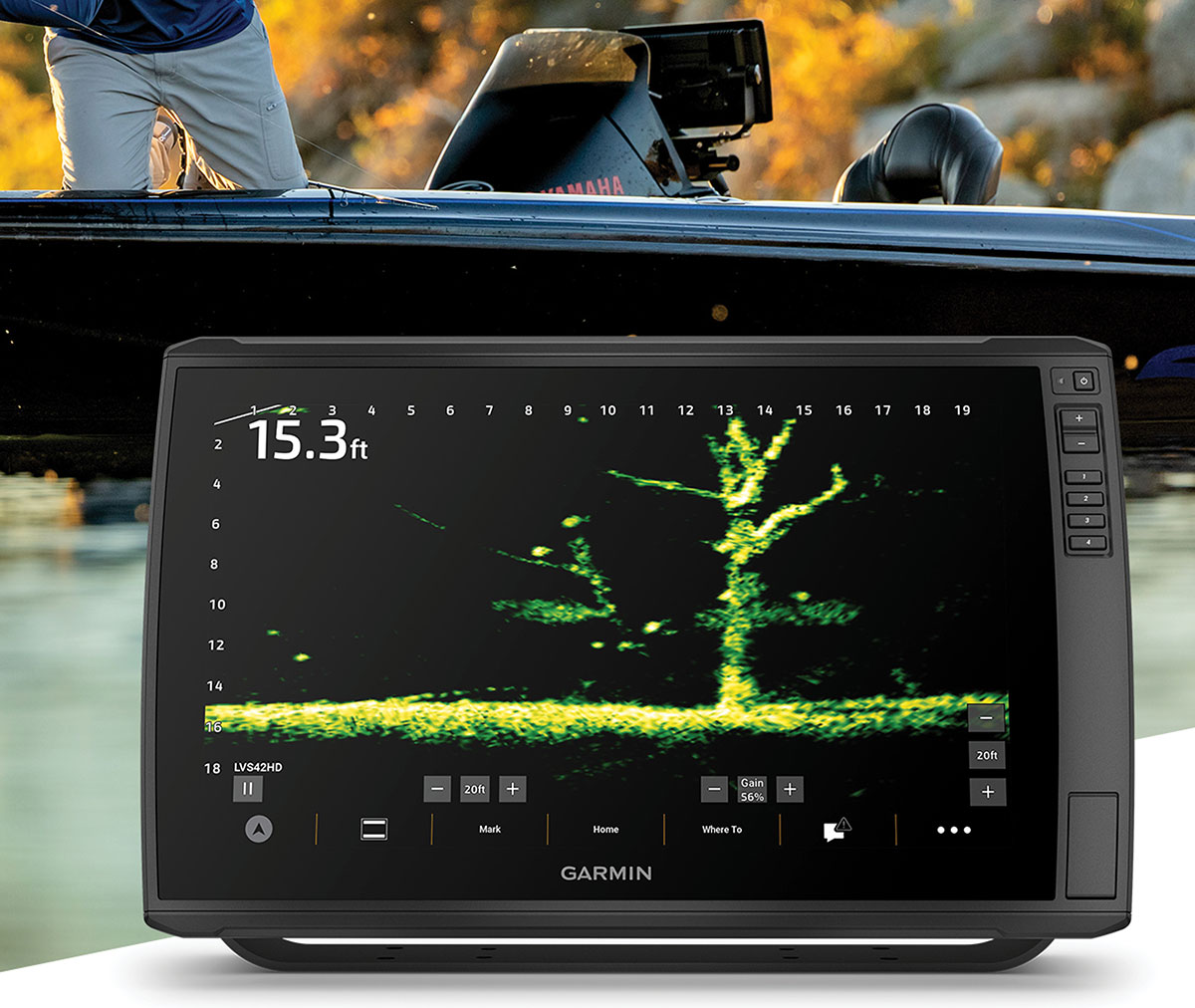 Garmin fishfinder display showing live sonar imaging of a submerged tree underwater, set against the background of a fishing boat.