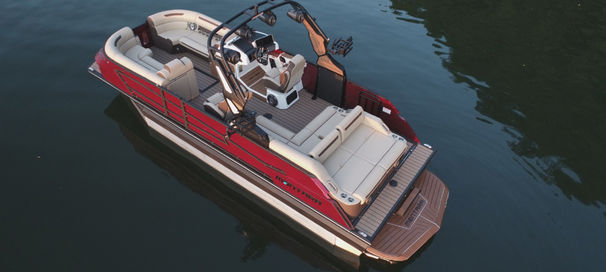 Overhead aerial view of a red and beige Montara pontoon boat showing its luxury interior layout.