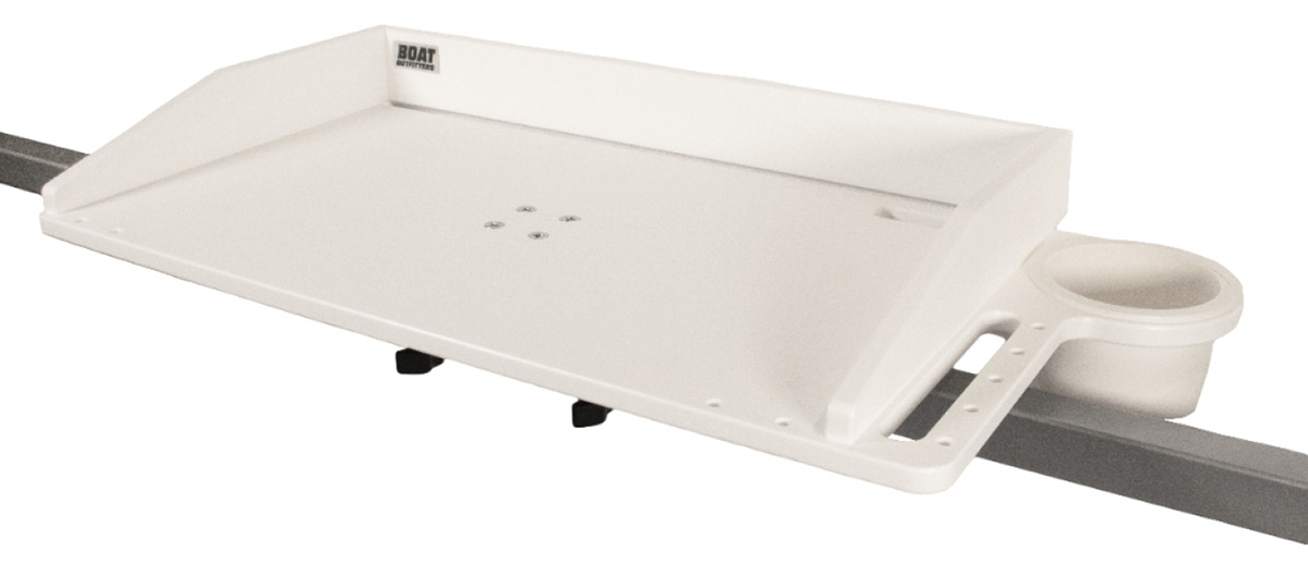 A white Boat Outfitters utility tray table mounted on a metal rail, featuring raised edges, an integrated cup holder, and tool storage slots.